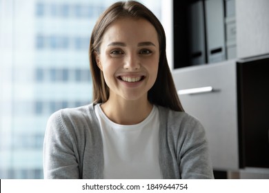 Nice to meet you. Portrait of smiling confident young lady intern trainee employee looking at camera or gadget webcam taking part in video conference online briefing training webinar, profile picture - Shutterstock ID 1849644754