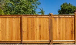 Nice New Wooden Fence Around House. Wooden Fence With Lawn. Street Photo, Nobody, Selective Focus