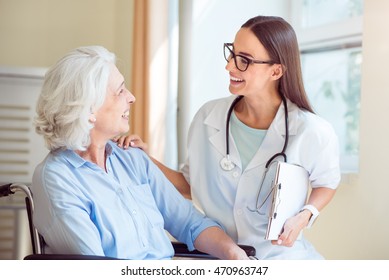 Nice Nurse With Senior Patient