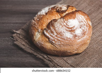 Nice photo about delicious fresh bread on sacking on the table. For an article in the magazine, advertising - Shutterstock ID 688634152