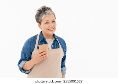 Nice positive mature middle age woman female barista in casual denim shirt wear beige apron offering handling you paper coffee cup to go take away isolated over white background copy space - Powered by Shutterstock