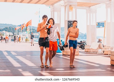 Nice, Provence / France - September 29, 2018: Three young teenagers are walking together from the beach - Shutterstock ID 1267669543