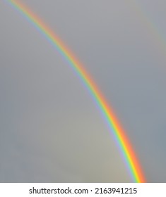 nice rainbow in the cloudy sky - Shutterstock ID 2163941215