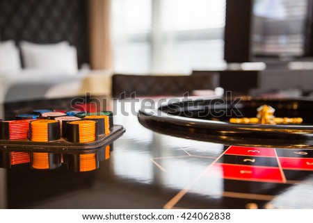 Nice roulette table with chips in a hotel room in Zurich