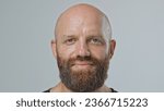 Nice sad bald 30s man look camera close up. Ginger upset 40s guy face portrait. Male red bushy beard head shot. No hair life. Unhappy model have fun. Brutal young adult bald person smile. Barber shop.