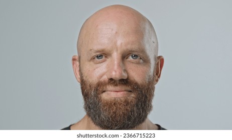 Nice sad bald 30s man look camera close up. Ginger upset 40s guy face portrait. Male red bushy beard head shot. No hair life. Unhappy model have fun. Brutal young adult bald person smile. Barber shop. - Powered by Shutterstock