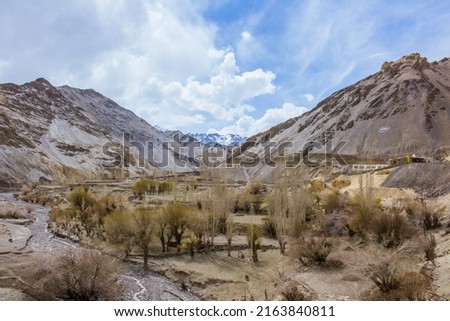Nice scenery with combinations of snow mountain, rocky hills, and greenry trees