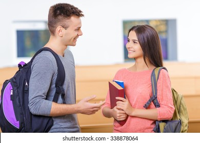 Nice To See You. Good-looking Young Female Student Meets Her Fellow Student In The Classroom.