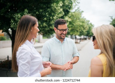 It Is Nice To See You. Three Friends Talking Outdoors.