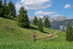 Nice Senior Woman Riding Her Electric Mountain Bike In The Lech Valley Mountains Near Reutte In Tirol, Austria