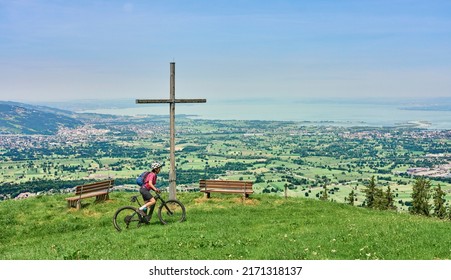 nice senior woman riding her electric mountain bike  in the Bregenzer Wald mountain range above Bregenz and Lake of Constance in Vorarlberg, Austria - Shutterstock ID 2171318137