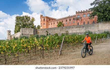 nice senior woman riding her electric mountain bike in the vineyards below Castello Brolio in the Ghianti Area of Tuscany,Italy
 - Powered by Shutterstock