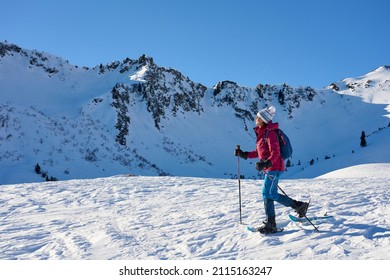   nice senior woman snowshoeing on the Kleinwalsertal in Vorarlberg, Austria                        - Powered by Shutterstock