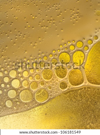 Nice shaped fluid bubbles in a yellow colored mixture