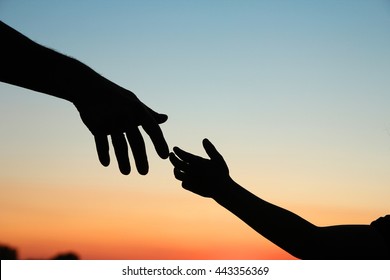 nice silhouette parent and child hands