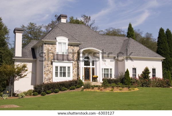 Nice Stone Stucco House On Grassy Stock Photo (Edit Now) 6303127