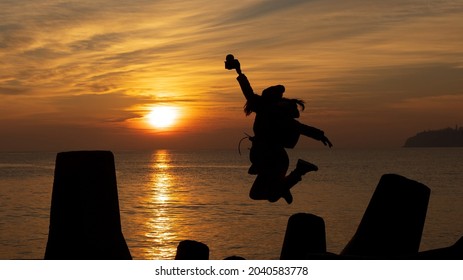 Nice Sunset Landscape On A Beach With A Guy Playing The Guitar.