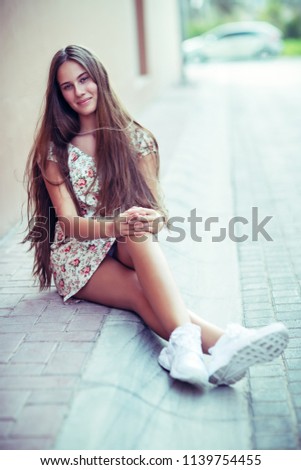 Image, Stock Photo Smiling young woman in urban background