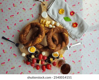 Nice Turkish Breakfast, bagels, tomatoes, boiled eggs, olives, cheese and tea served - Powered by Shutterstock