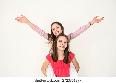 Nice Two cute and Young pre teen girl on studio white