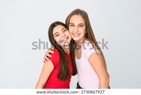 Nice Two cute and Young pre teen girl on studio white
