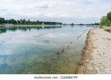 Nice view of Idroscalo lake park, on the left the stands, on the right a quay where young boys and girls prepare their canoes to training. - Powered by Shutterstock