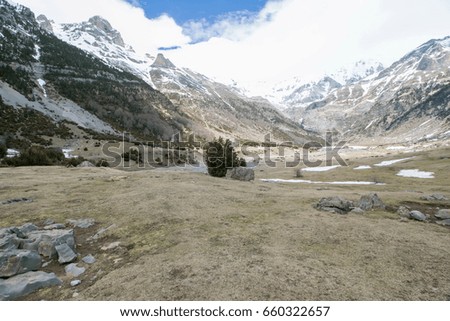 Similar – Image, Stock Photo Ski area with snow-covered mountains in the background