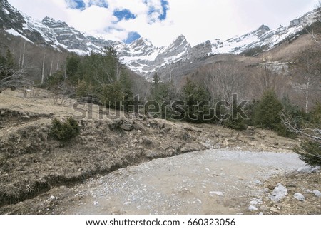 Similar – Image, Stock Photo Ski area with snow-covered mountains in the background