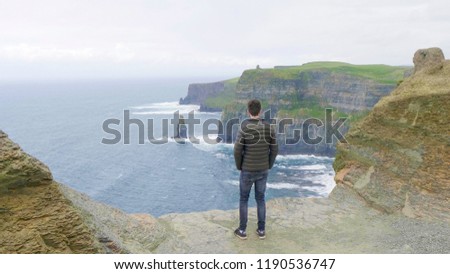 Similar – Ireland, Cliffs of Moher, woman, hiking