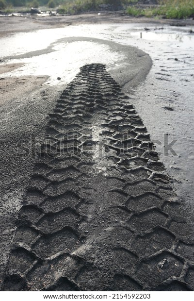 nice wallpaper, is an object of truck tire tracks on
a layer of black soil