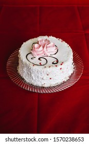 Nice White Vanilla Cake With A Missing Piece On A Glass Plate