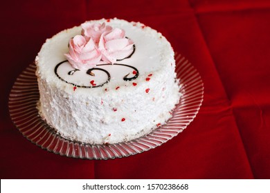 Nice White Vanilla Cake With A Missing Piece On A Glass Plate