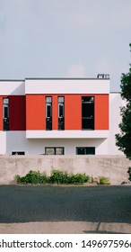nice withe building painted in big red stripe