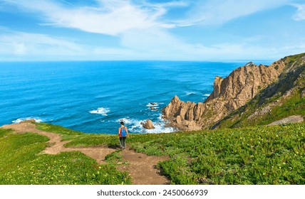 nice woman hike on the rocky cliffs of Cabo da Roca at the Atlantic coast of Portugal, Europe - Powered by Shutterstock