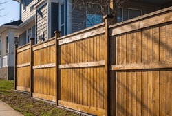 Nice Wooden Fence Around House. Wooden Fence With Green Lawn. Street Photo, Nobody, Selective Focus
