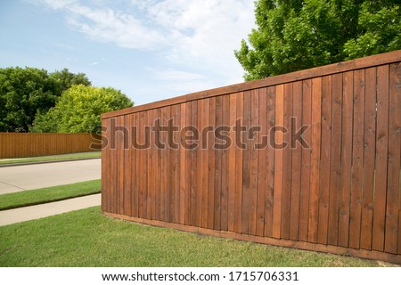 Nice wooden fence around house