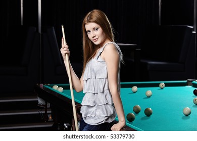 The Nice Young Girl With Cue At A Billiard Table