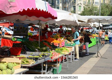 Nice/France - 06/04/2019: Marketplace in Nice, Malaussena street, with different market stalls and customers.