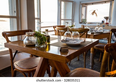 Nicely Set Dinner Table At A Seaside Restaurant