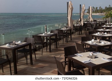 Nicely Set Dinner Table At A Seaside Restaurant