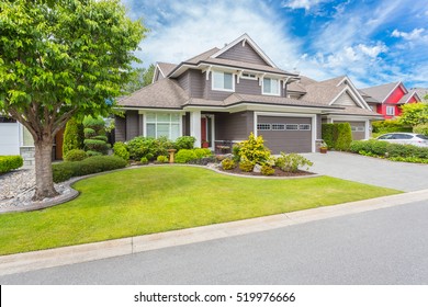 Nicely trimmed and manicured garden in front of a luxury house