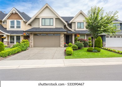 Nicely Trimmed And Manicured Garden In Front Of A Luxury House.