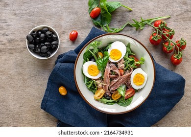 Nicoise French Composed Salad With Canned Tuna, Anchovy, Hard-boiled Eggs, Tomatoes, And Black Olives. A Delicious Meal For Summer, Dinner, Keto Diet. 