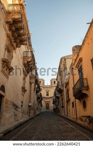 Nicolaci street with its decorated balcony  and Montevergine church in Noto, Sicly , Italy