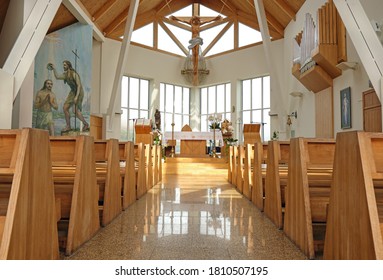 NIDA, LITHUANIA - 24 JULY, 2020: Modern Empty Catholic Church Interior Brightly Illuminated With Natural Window Light In Nida, Lithuania