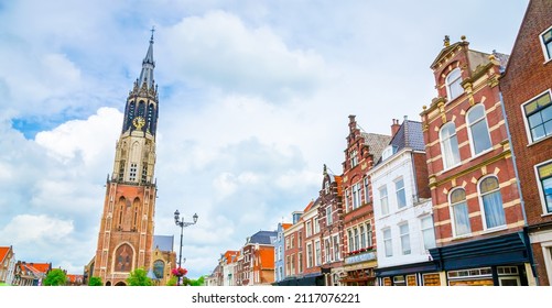 Nieuwe Kerk tower and traditional houses on Market square of old beautiful city Delft, Netherlands