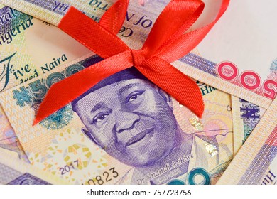 Nigerian Naira Notes With Christmas Red Ribbon On Nnamdi Azikiwe Close Up