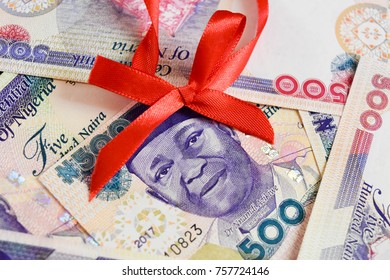 Nigerian Naira Notes With Christmas Red Ribbon On Nnamdi Azikiwe