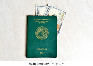 Nigerian Passport On White Background With US Dollar 