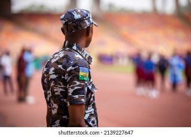 Nigerian Police In Camouflage Uniform With Badge